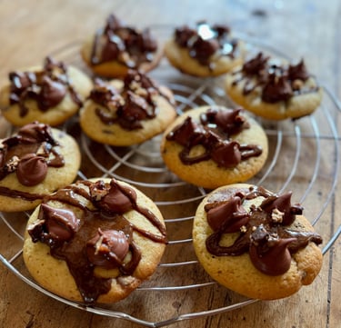 a bunch of cookies on a wire rack