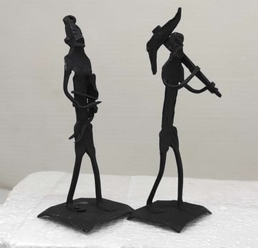 "Handmade iron sculpture of tribal farmer with plough, wife holding child-for worldwide trade"