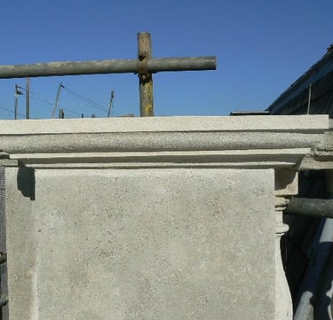 two scaffolding poles on top of a coping stone newly restored