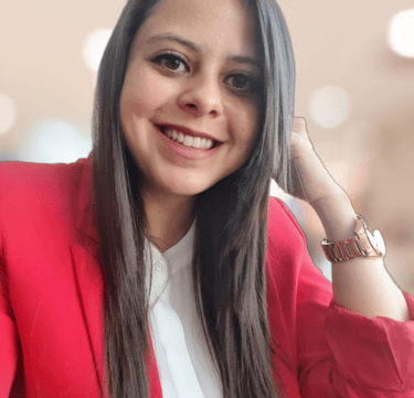 a woman in a red jacket and white shirt
