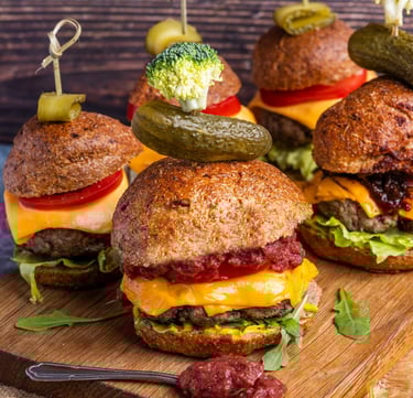 Sustainable plant-based, nutritionally-dense, hypoallergenic protein and fibre burgers displayed on a wooden board
