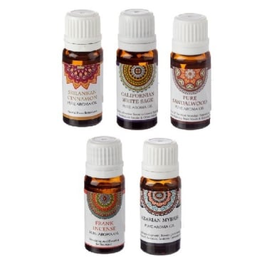 a group of five bottles of essential oils