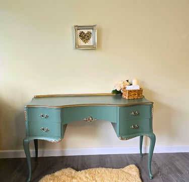 A painted french style dressing table painted in Farrow and Ball - Green Smoke with gold highlights