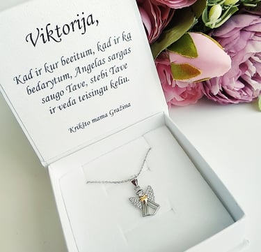 a white box with a silver cross on it