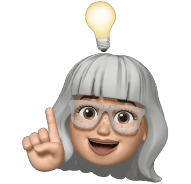 A smiling grey-haired female Memoji character with glasses having a bright idea with a glowing lightbulb.
