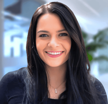 a woman with long hair and a black top