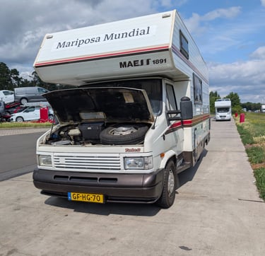 Campervan parked on a highway shoulder near Berlin after sudden brake failure during road trip.