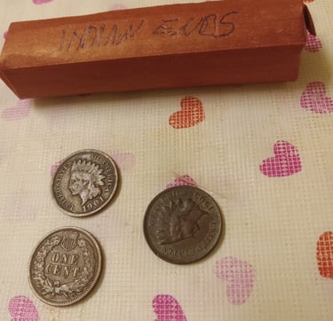 Roll of wheat pennies with Indian Ends, three Indian head pennies 