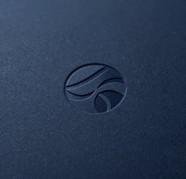 A close-up macro photograph of a corporate logo subtly debossed into premium dark navy #0A1118 paper. The texture of the paper is crisp and detailed. Lighting is minimalist and focused, highlighting the precision of the print design. Professional and sophisticated vibe.