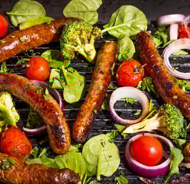 Sustainable plant-based, nutritionally-dense, hypoallergenic protein and fibre sausages with vegetables surrounding
