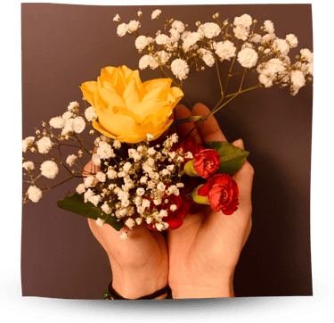 Martina holding flowers in her hands.