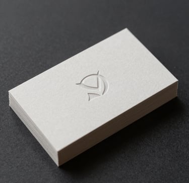Close-up detail of a minimalist branding project. A stack of premium textured paper business cards in #F8F8F4 with a debossed, sophisticated logo mark. The cards rest on a dark #0F1E2E background. Professional studio lighting emphasizes the crisp edges and refined texture of the paper. Minimalist and high-end aesthetic.