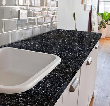 Modern kitchen black granite-look countertop — DIY upgrade, sleek black finish.