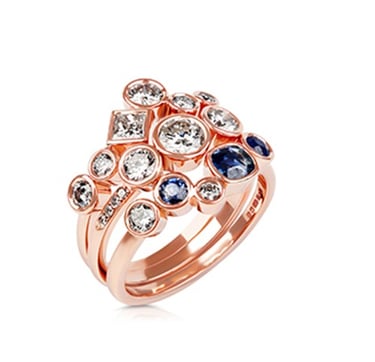 a rose gold ring with sapphire and diamonds
