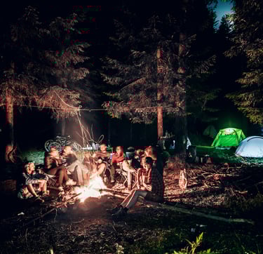 a group around a campfire. Summer camp.Vacation Rental Consulting with Timea Pokol Consultant