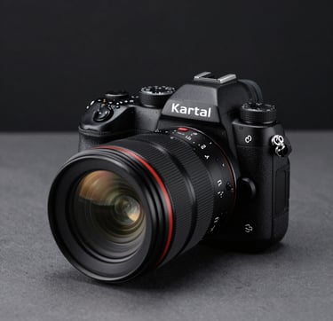 A close-up of a high-end professional camera and lens setup in a modern photography studio in Kartal, Istanbul. The gear is placed on a charcoal grey surface with minimalist styling. The scene is illuminated with a soft off-white light, creating subtle reflections on the glass. The background is a clean, deep black, conveying luxury and precision.