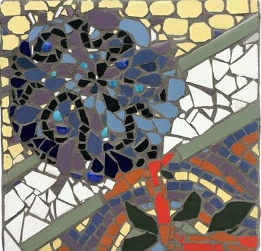 Blue floral mosaic stepping stone with intricate colorful ceramic details. by artist Julie Curson