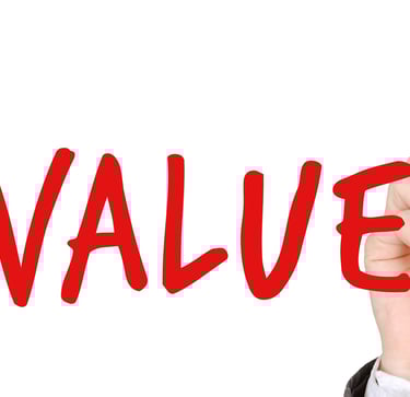 hand writing the word "values" with a marker symbolizing augusta precious metals blog post about their values