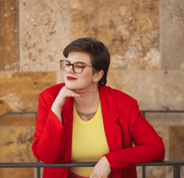 Swana Schuchmann in a red jacket and glasses