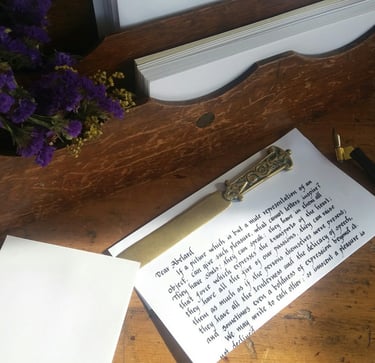 A handwritten letter with a brass letter opener