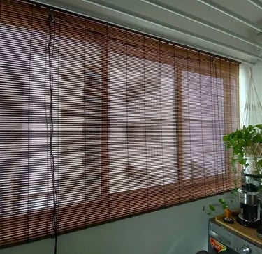Bamboo blind installed in a room