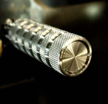close up of a aluminum foot peg with knurling and grooves