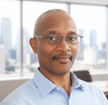 Self-Published author and founder of Christians Codes Books in a blue shirt and glasses