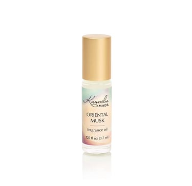 a bottle of oriental musk fragrance oil with a gold cap