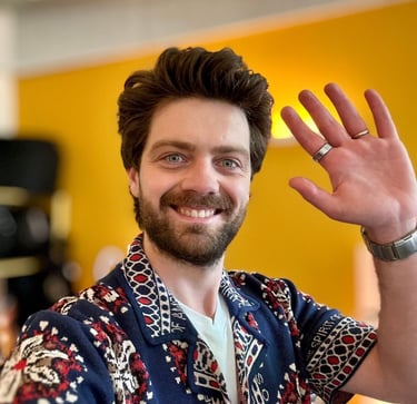 a man with a beard and a ring on his finger