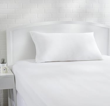 a bed with a white bedding and a white bed