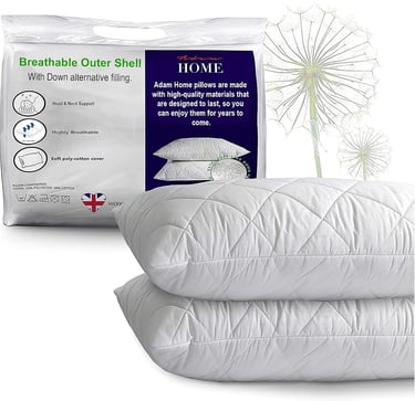 a bed with a pillow and pillows on it