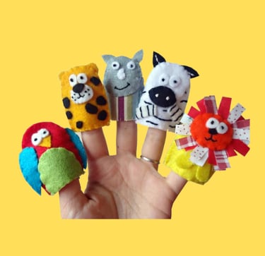 a person's hand holding a finger puppet animal finger puppets