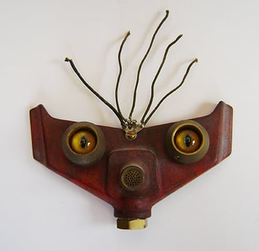 Assemblage robot head named Bright Eyes built by artist Tal Avitzur.
