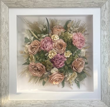 a Birdseye view preserved wedding bouquet in a frame