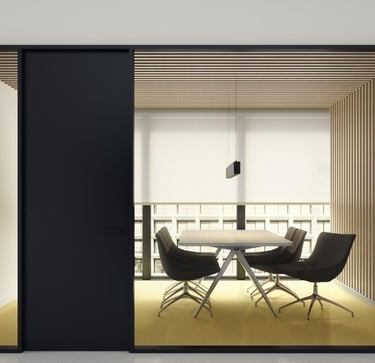 Sala de reuniones moderna con mamparas correderas de cristal y mobiliario minimalista