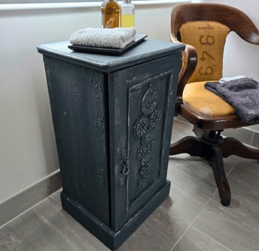 A painted vintage pot cupboard in a modern bathroom