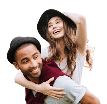 Man carrying woman on his back smiling