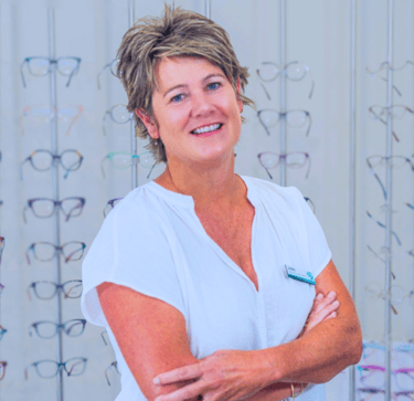 Juliet Clague Optical Consultant Smiling woman with shorth ash blonde hair blue eyes