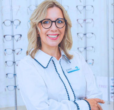Lynette Hunter - Owner and dispensing Optician Smiling woman Blonde shoulder length hair glasses