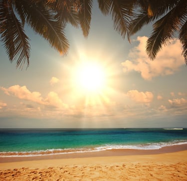 a beach scene with a sun shining over the ocean
