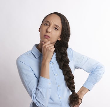 woman thinking thoroughly and wondering if gold ira is a scam