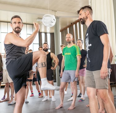 men learning a movement workshop