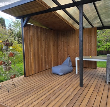 a patio with a bean bag on the deck