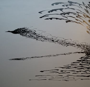 a bird flying over a body of water