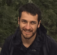 Chiapas birding guide Valente Gonzalez smiling to the camera in front of a jungle background