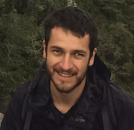 Chiapas birding guide Valente Gonzalez smiling to the camera in front of a jungle background