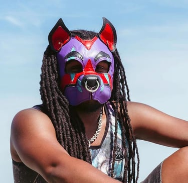 Man in pup mask at the beach.