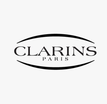 Logo of CLARINS, a global beauty brand whose standards are met by King Fly.