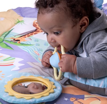 Baby playing on an Arabic playmat by Desi Doll