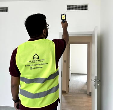 Engineer inspecting HVAC ducts during property inspection in Dubai